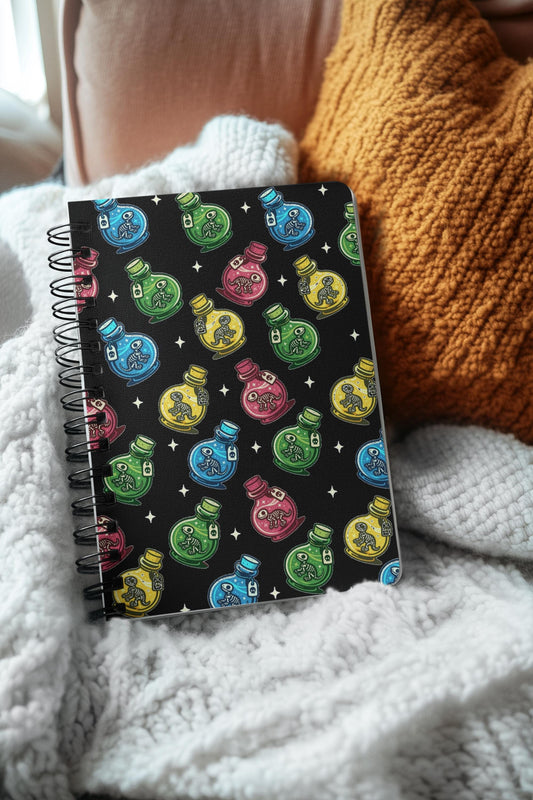 Colorful Dino Potion Notebook – Pastel Goth Journal, Witchy Spiral Notebook, Spooky Cute Dinosaur Stationery. Cute Spooky dinosaur lab notes